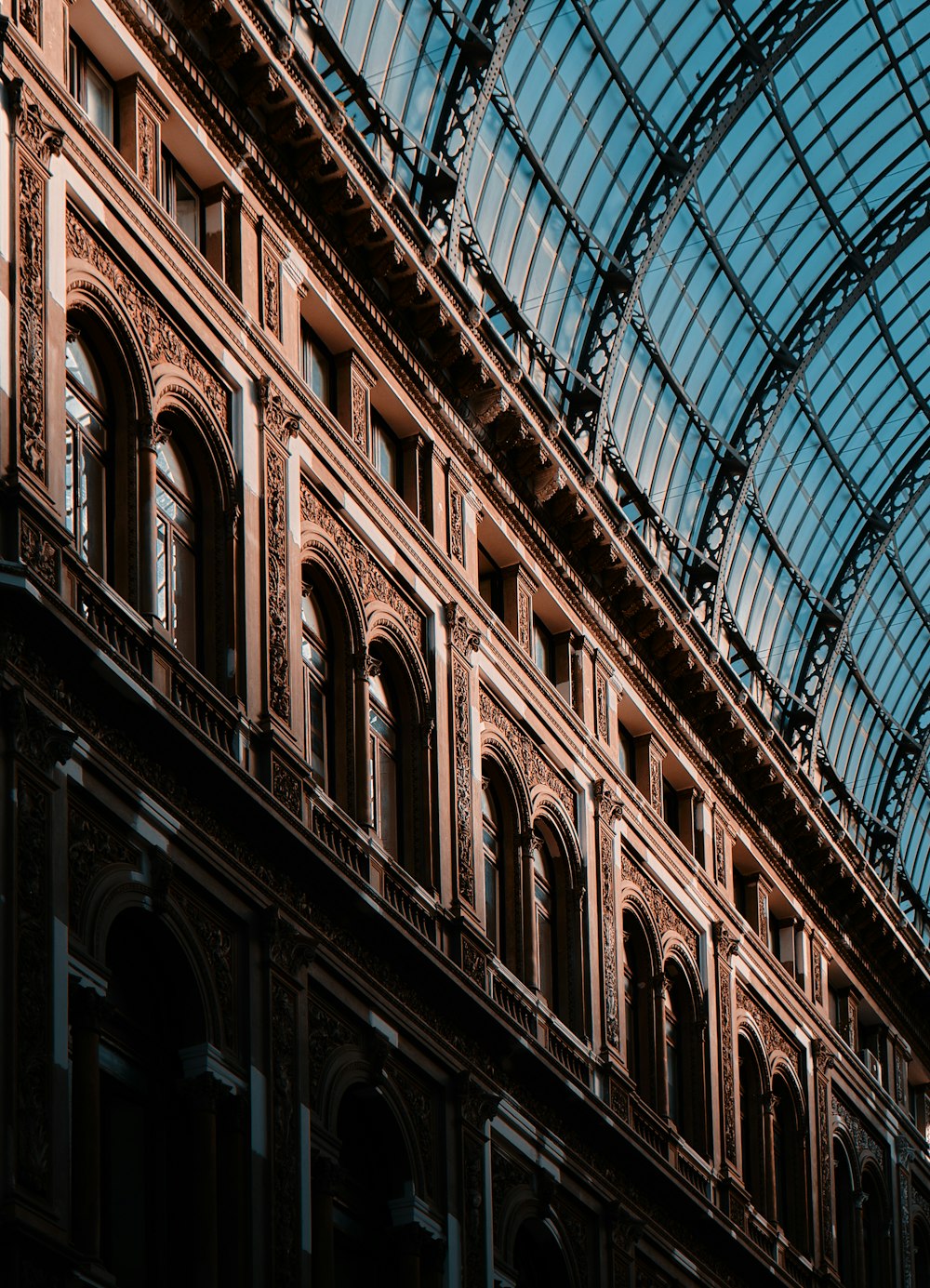 a building with a glass roof and a clock