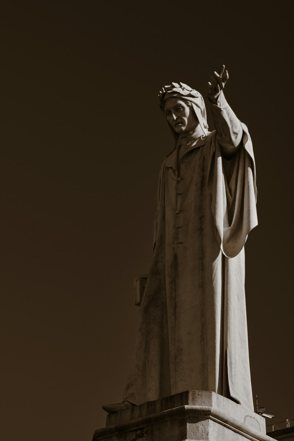 a black and white photo of a statue of jesus