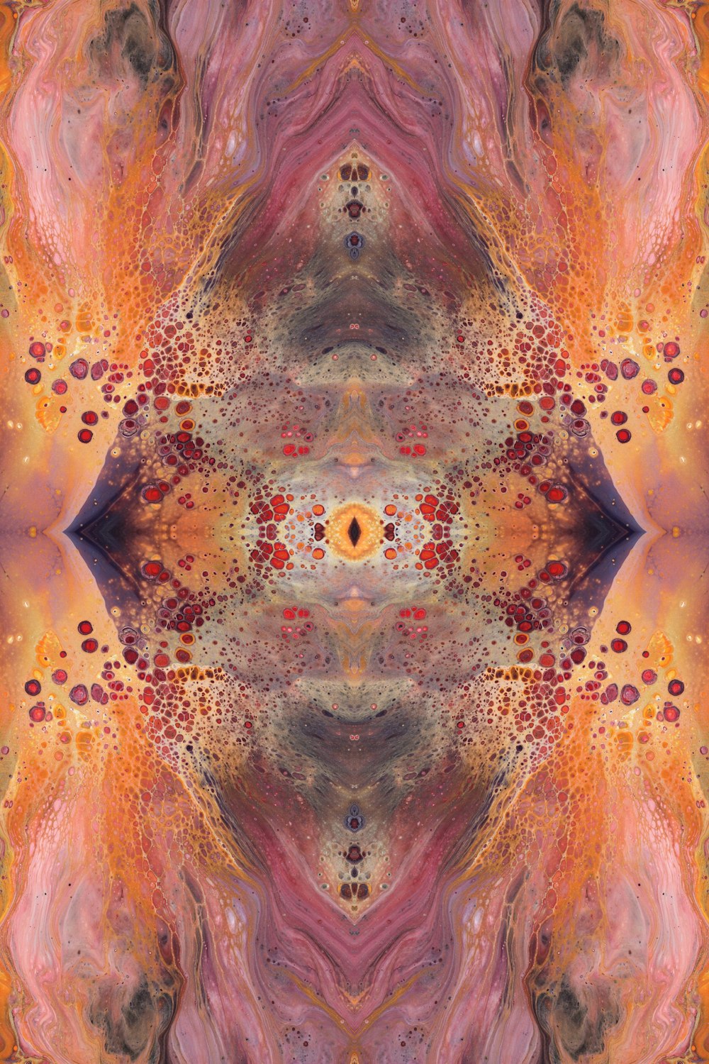 an abstract image of an orange, pink, and yellow flower