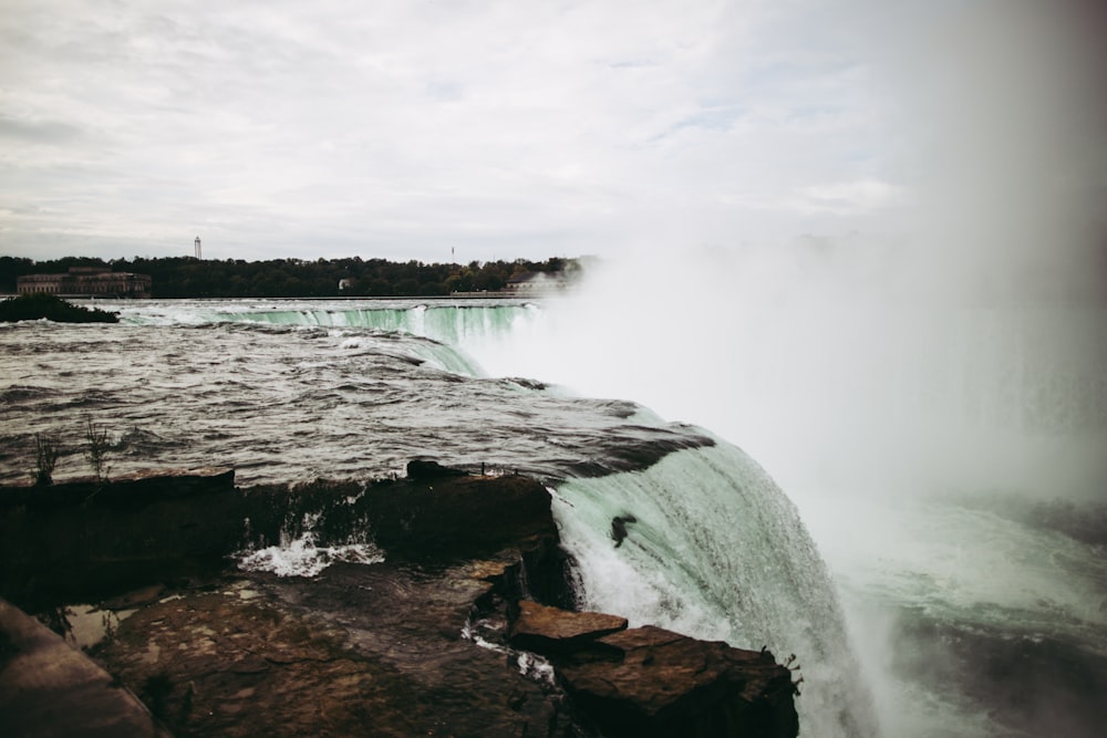 a large waterfall with water pouring out of it