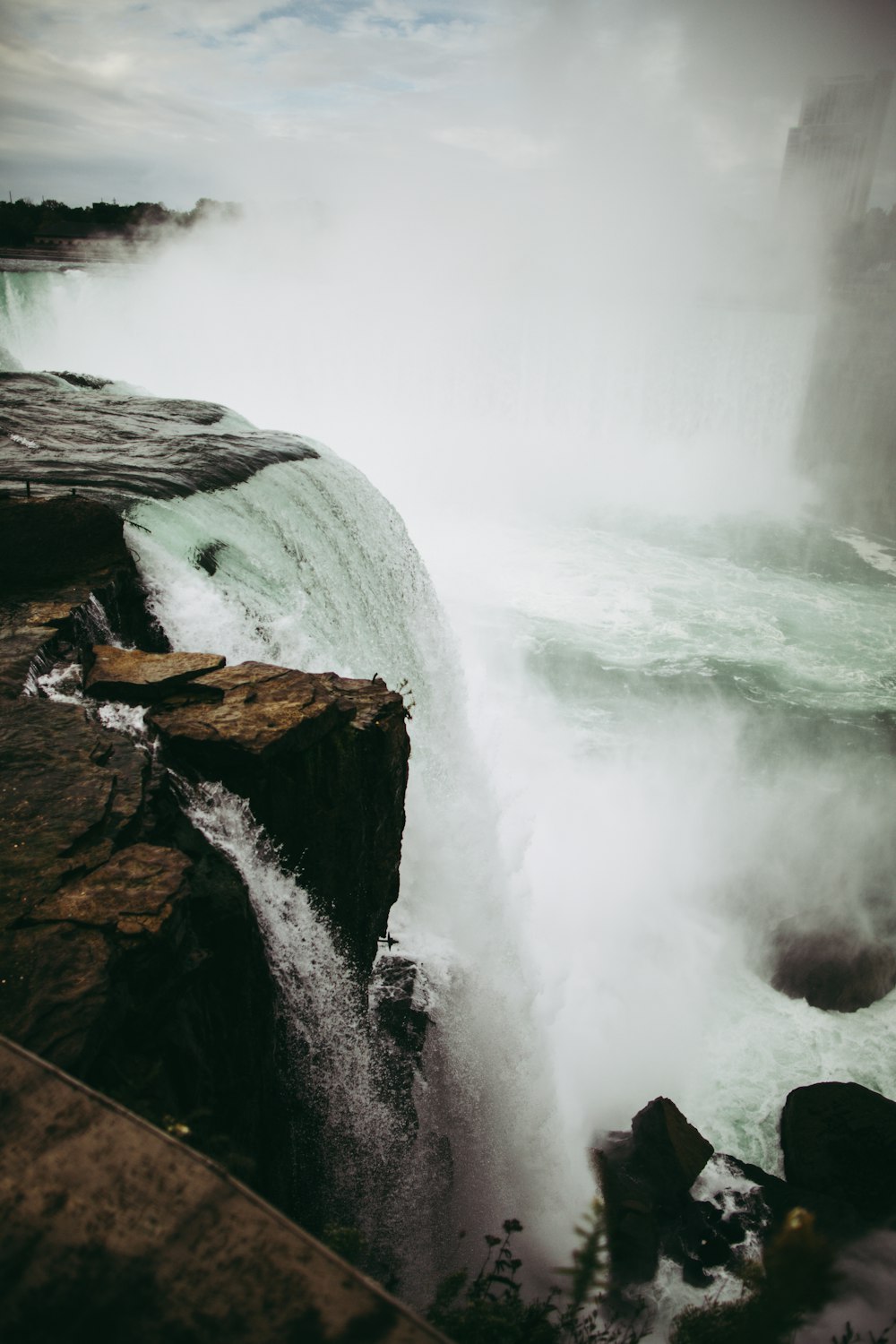 a large waterfall with water pouring out of it