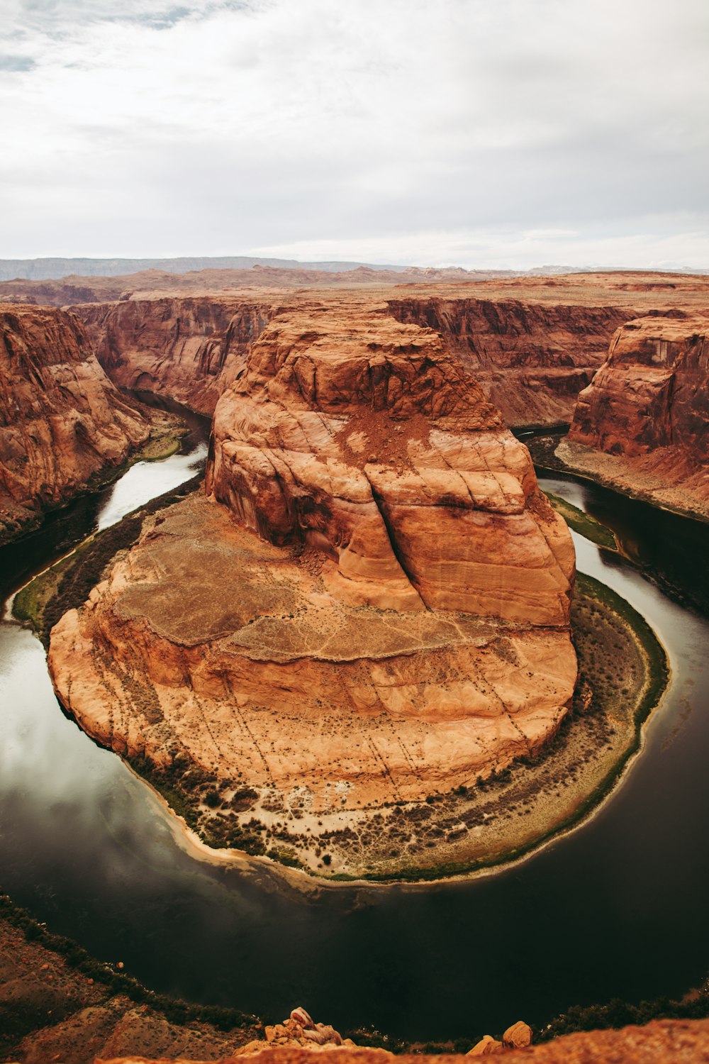 a river running through a canyon surrounded by mountains