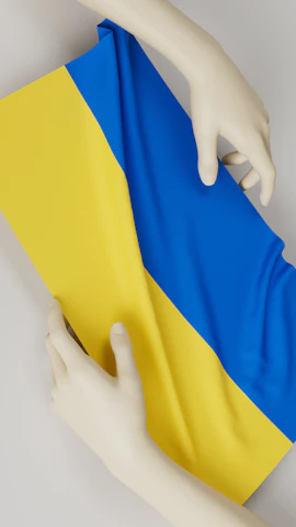 Our team carefully folding a cotton saree, highlighting fabric texture.