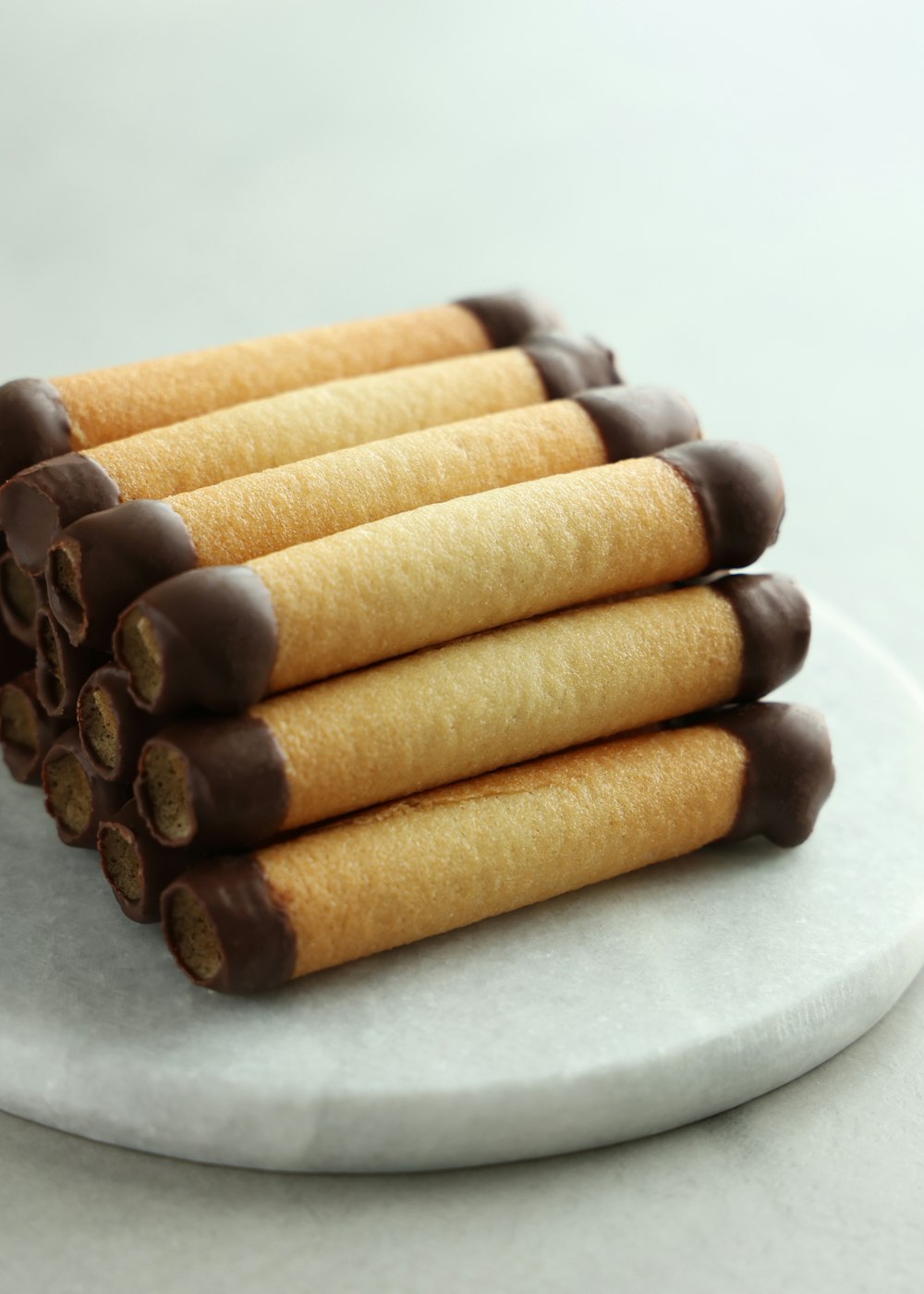 a white plate topped with chocolate covered cookies