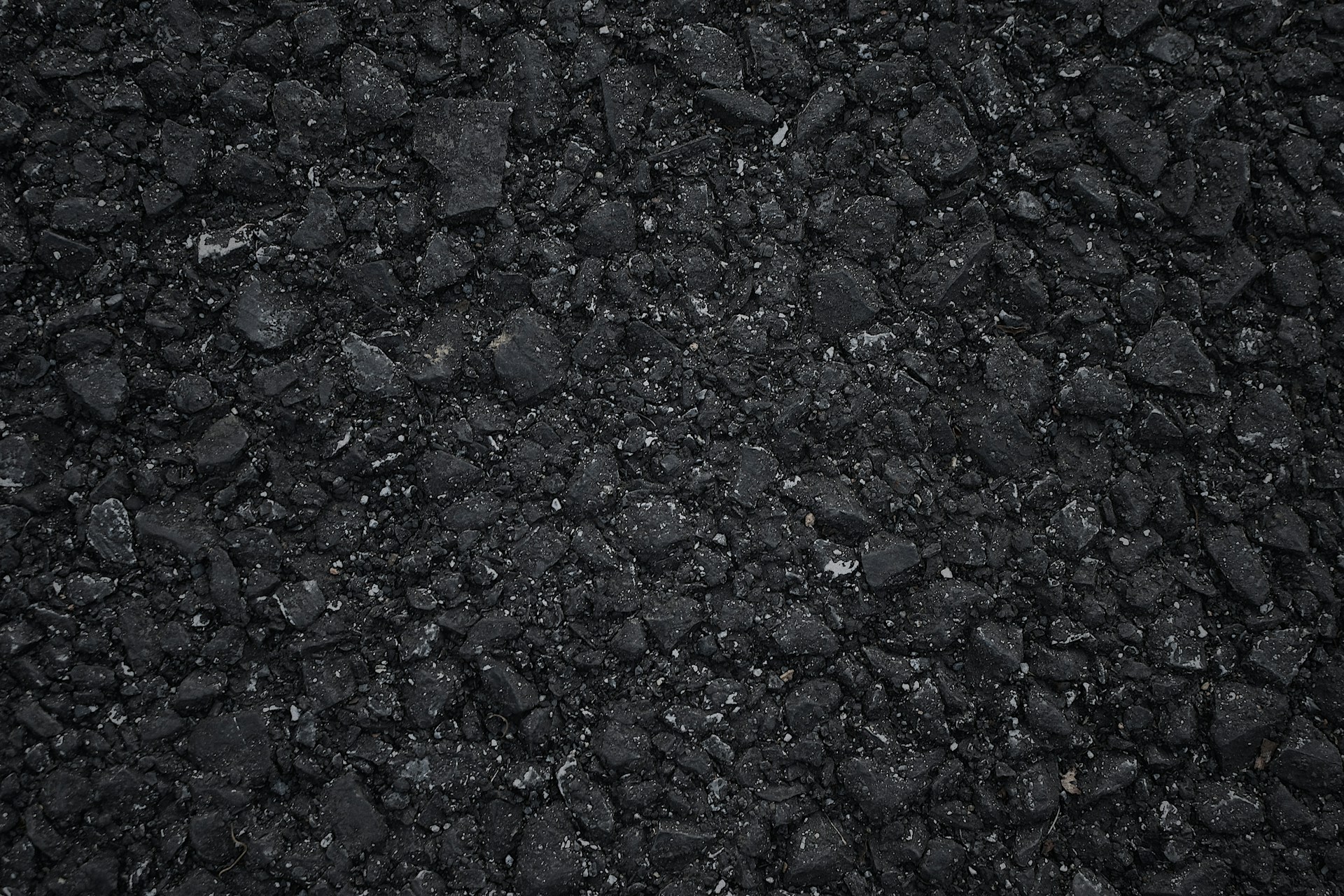 a close up of a black asphalt surface