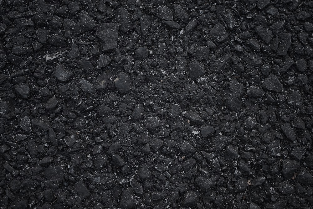 a close up of a black asphalt surface