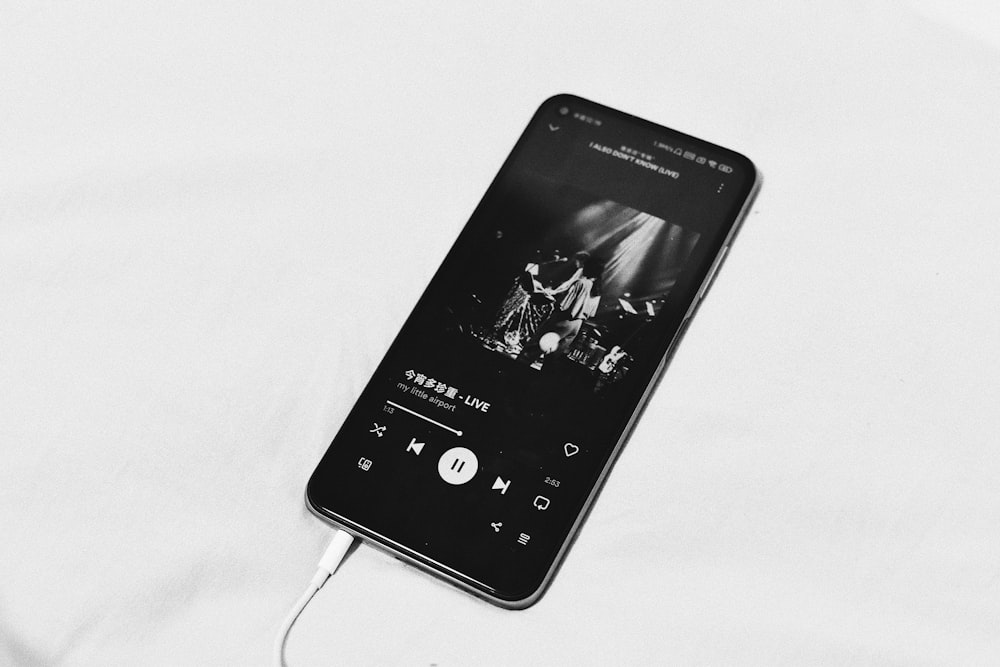 a black and white photo of an mp3 player
