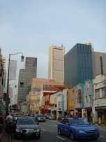 a city street filled with lots of tall buildings