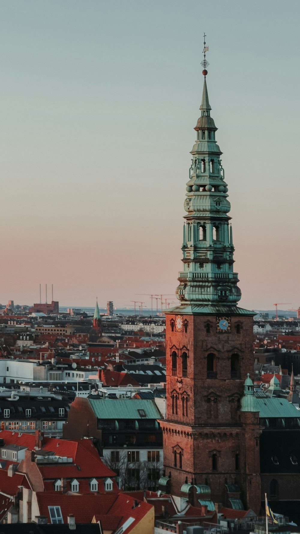 a tall clock tower towering over a city