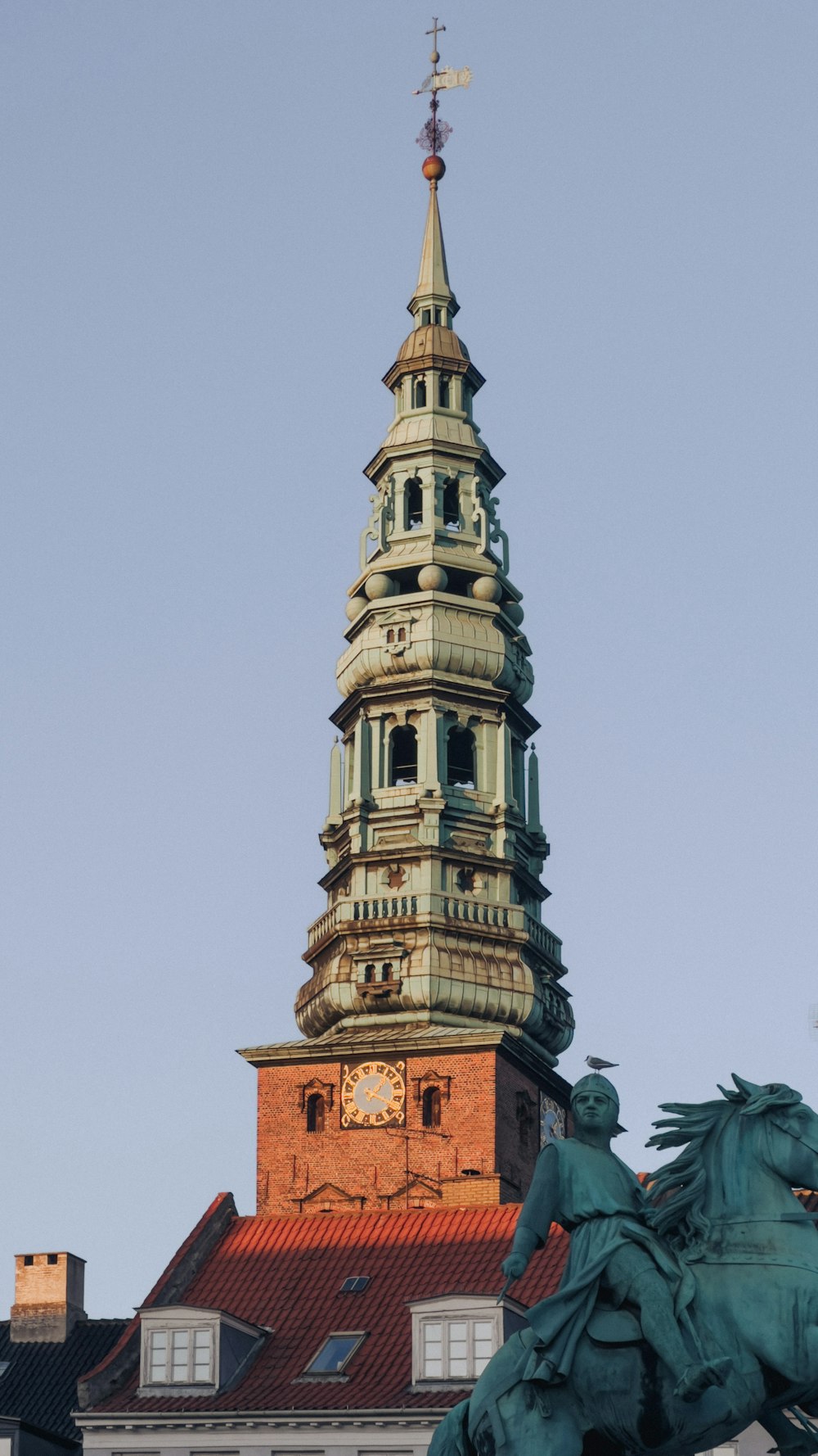 a statue of a man on a horse in front of a building