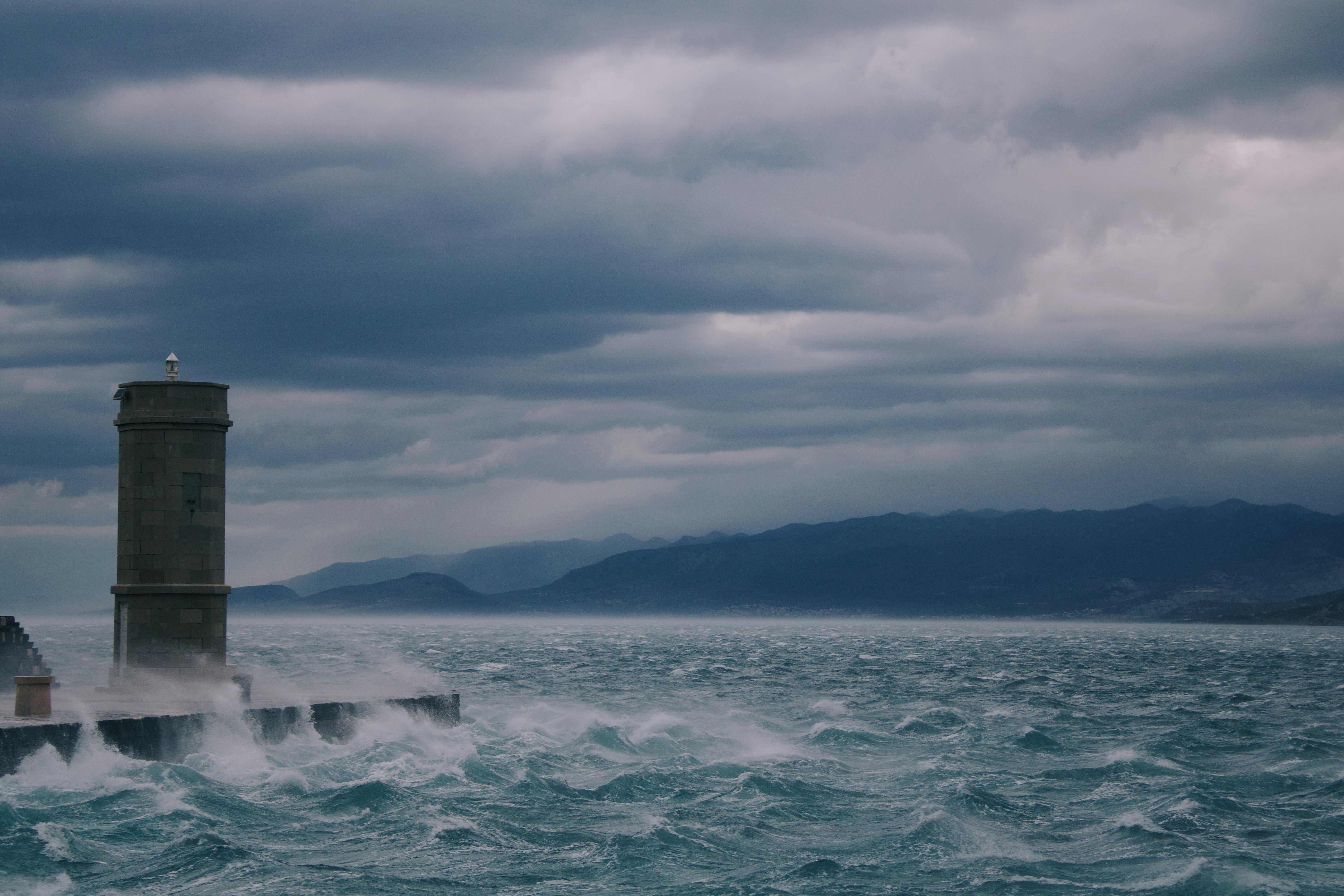 a lighthouse in the middle of a large body of water