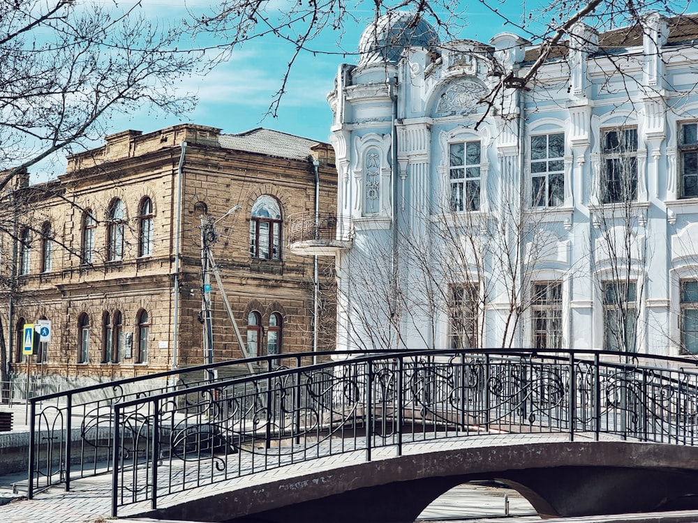 a bridge over a river in front of a building