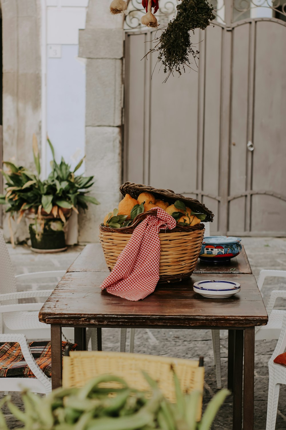 a table with a basket of fruit on top of it