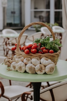 a basket of vegetables sitting on top of a table