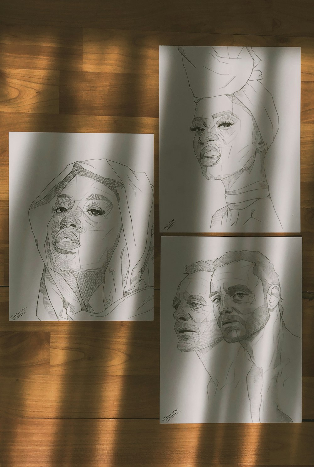 three drawings of a woman's face on a piece of paper
