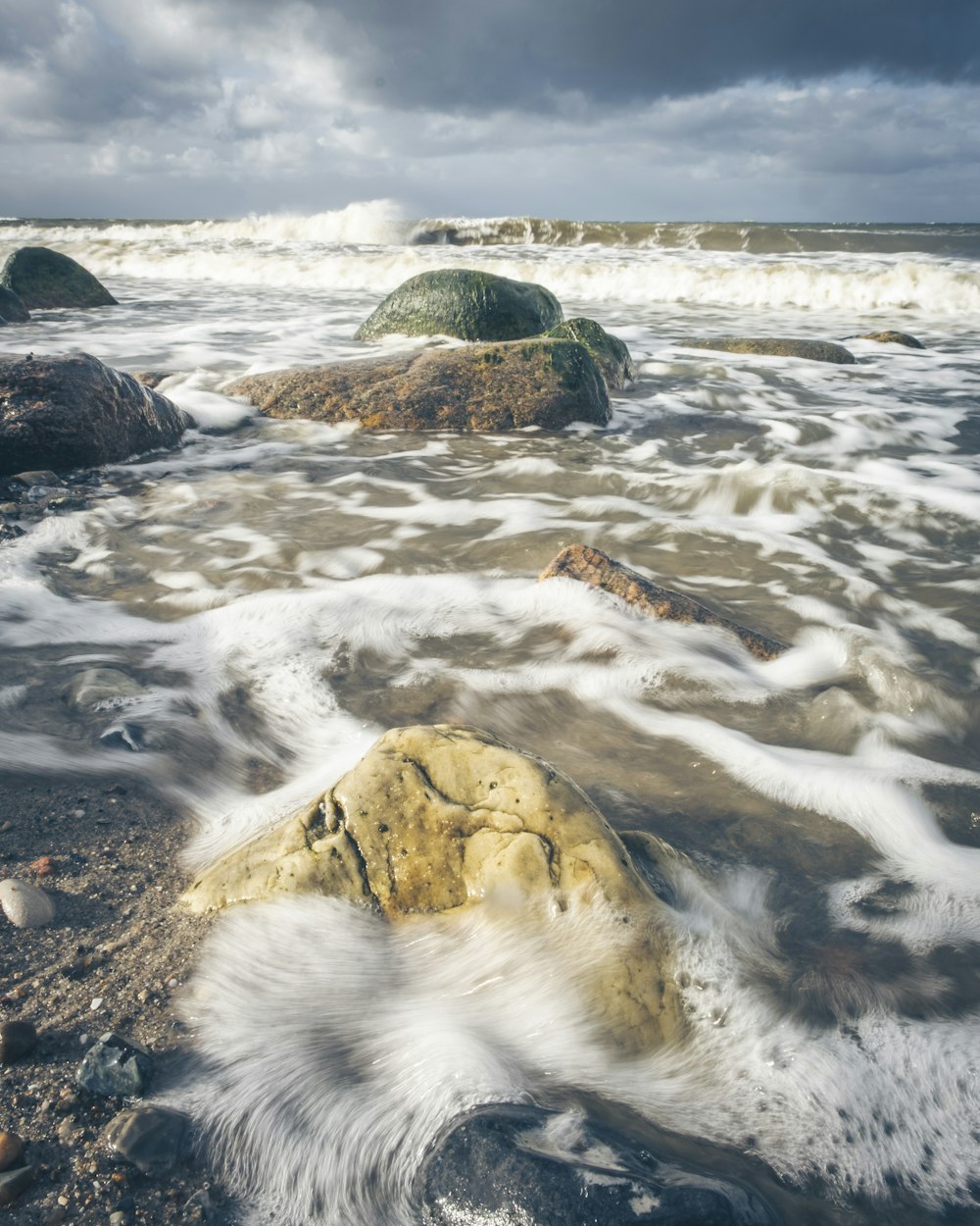 a rock in the middle of a body of water