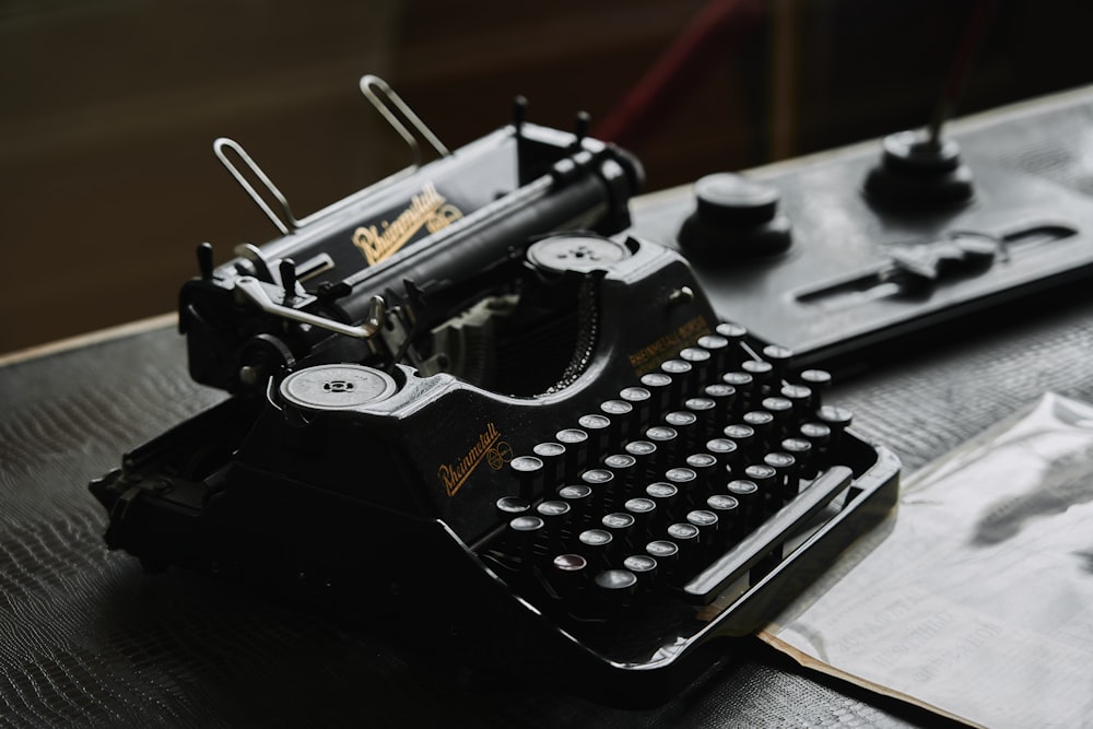an old fashioned typewriter sitting on top of a table