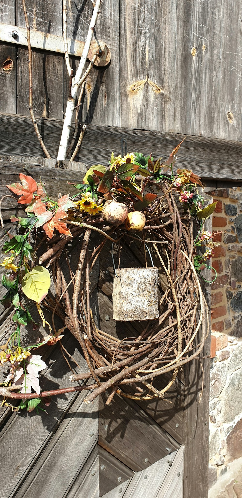 a birdhouse with a bird sitting on top of it's nest