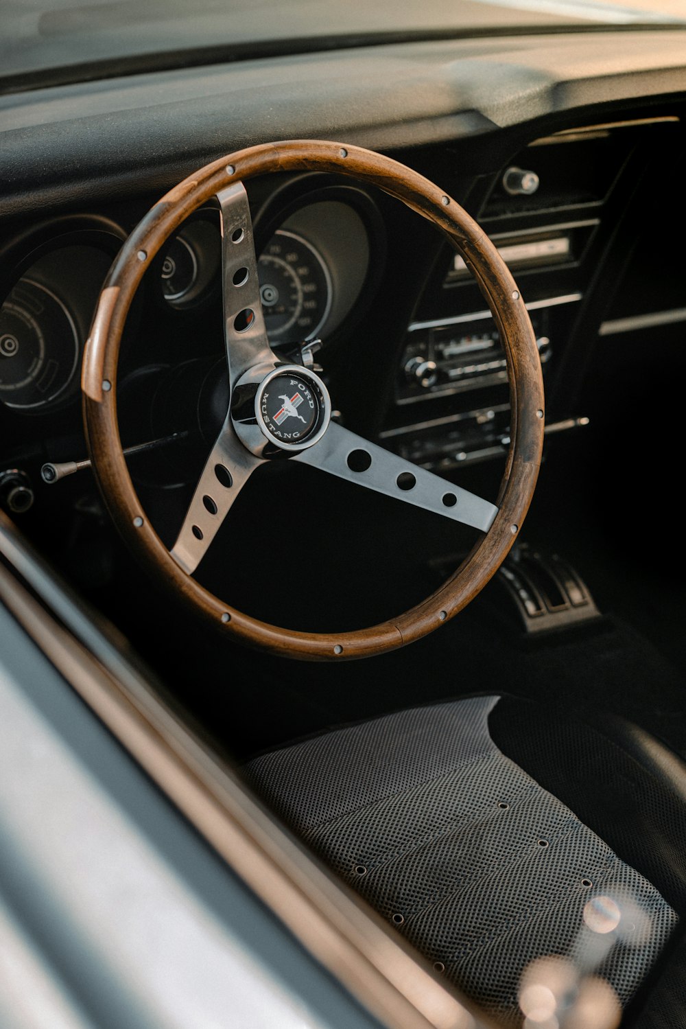 a steering wheel and dashboard of a car