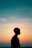 a man standing in front of a sunset