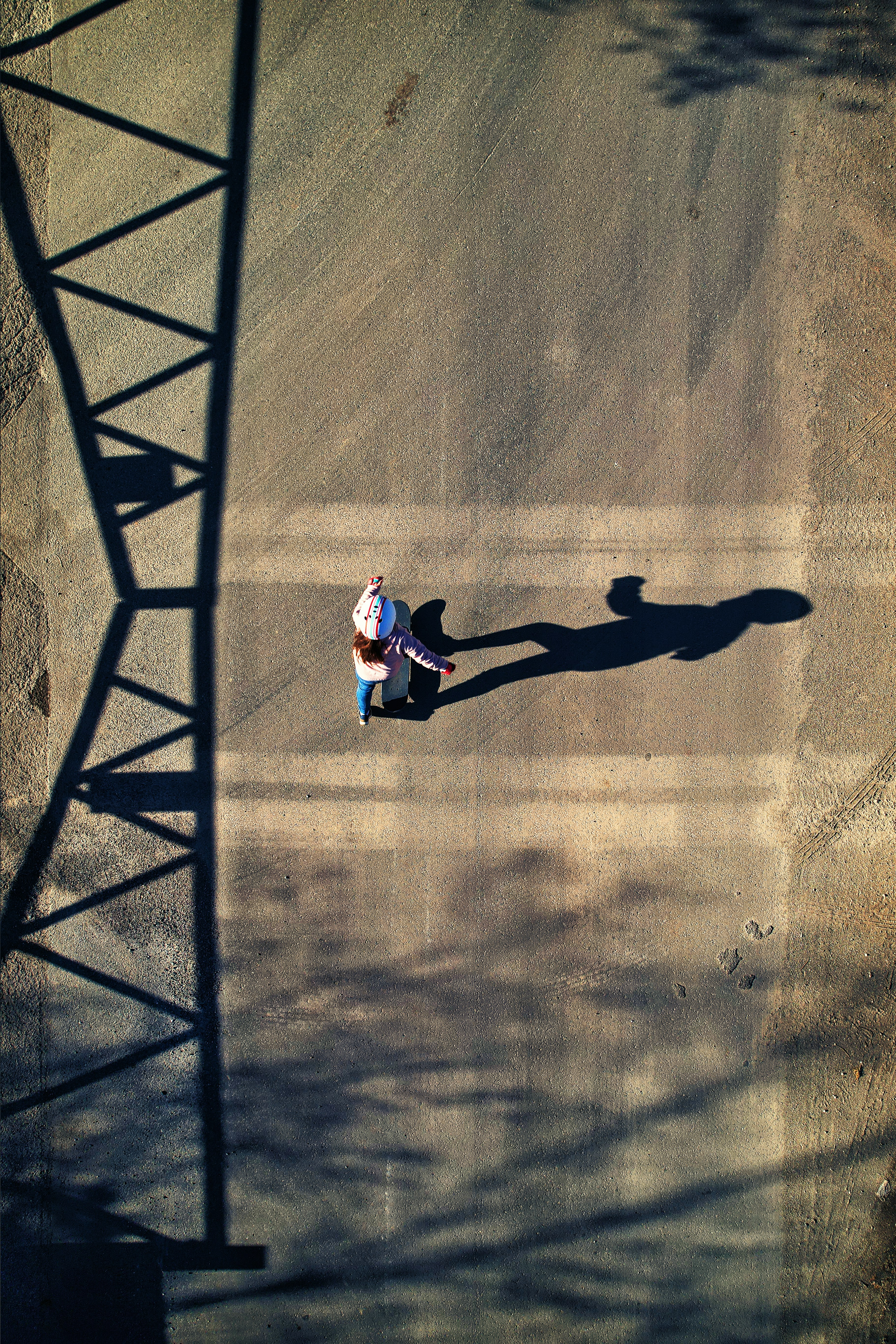 a person riding a skateboard down a street