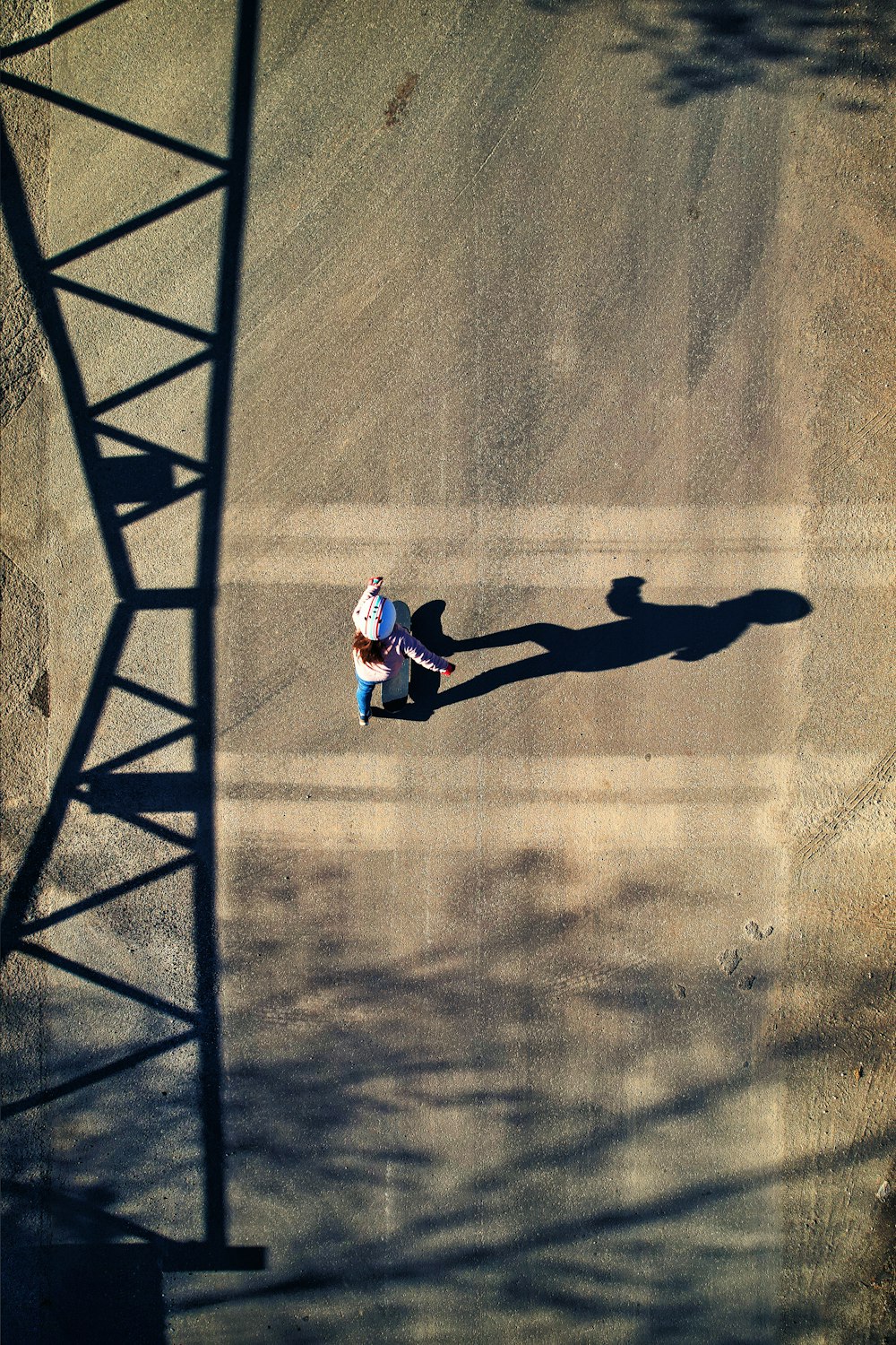 a person riding a skateboard down a street