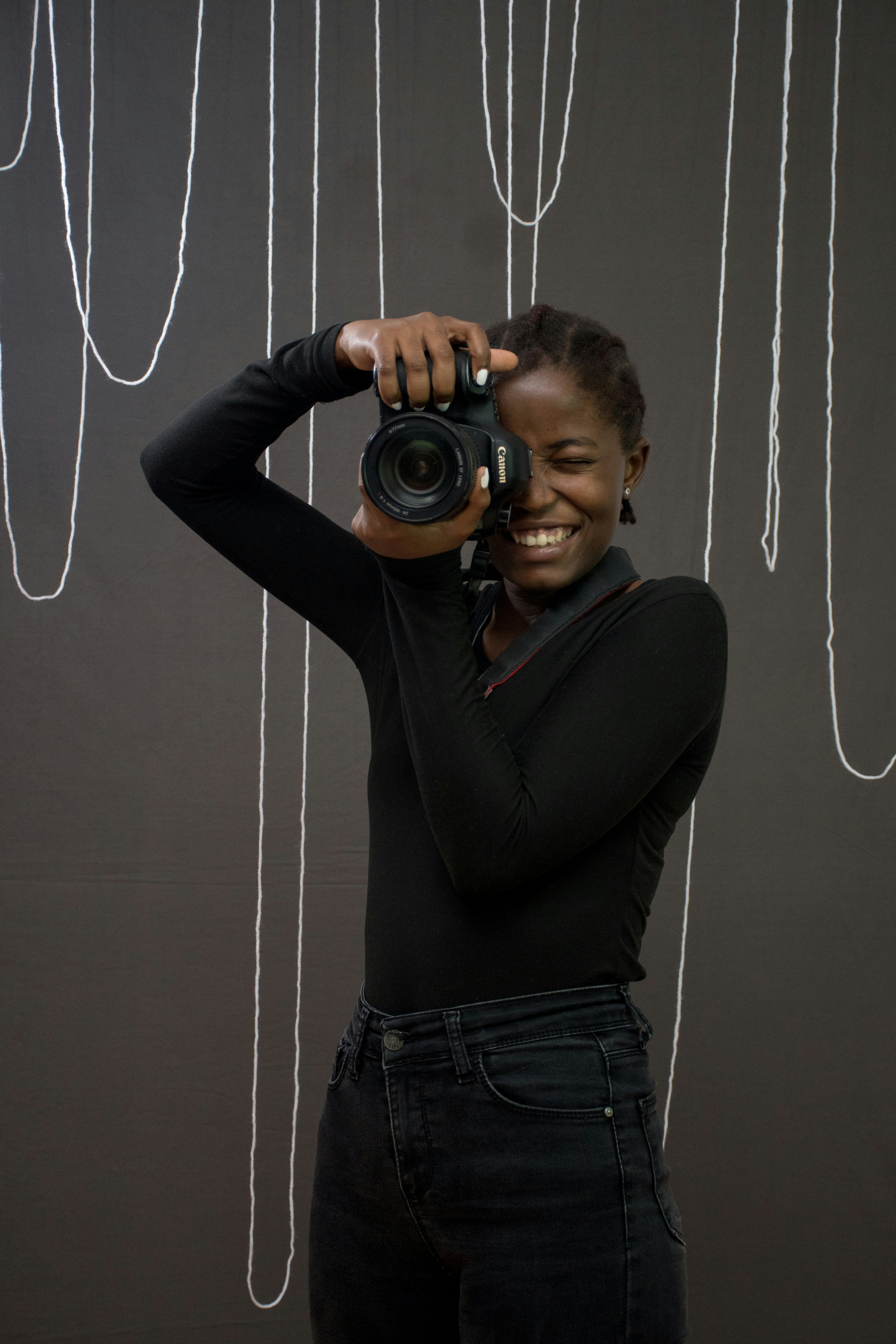 a woman taking a picture with a camera