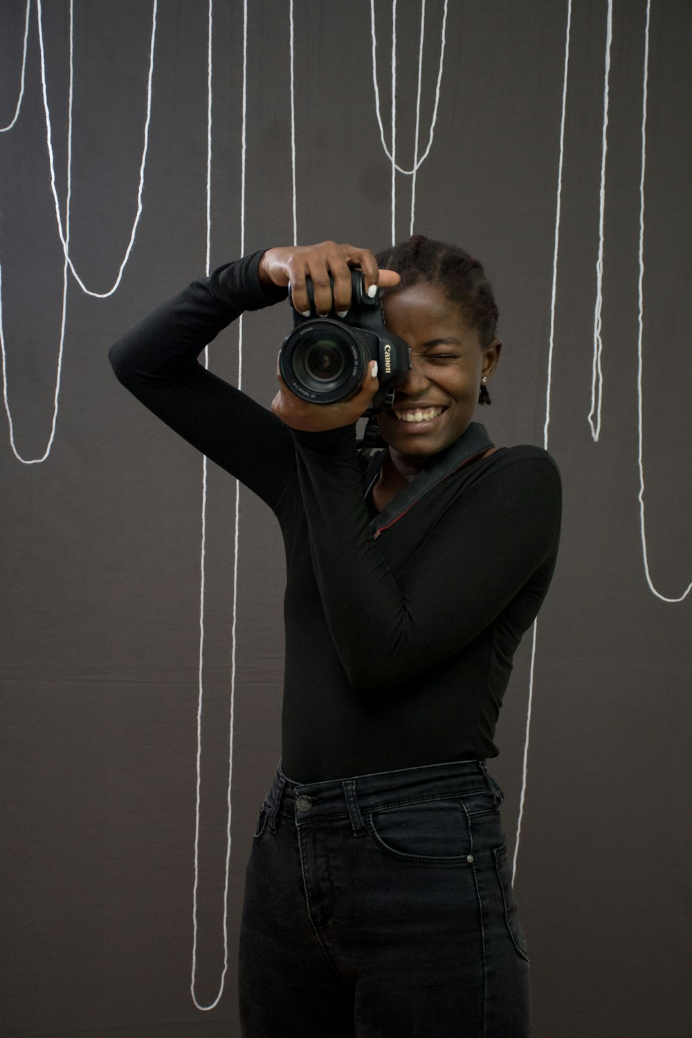 a woman taking a picture with a camera