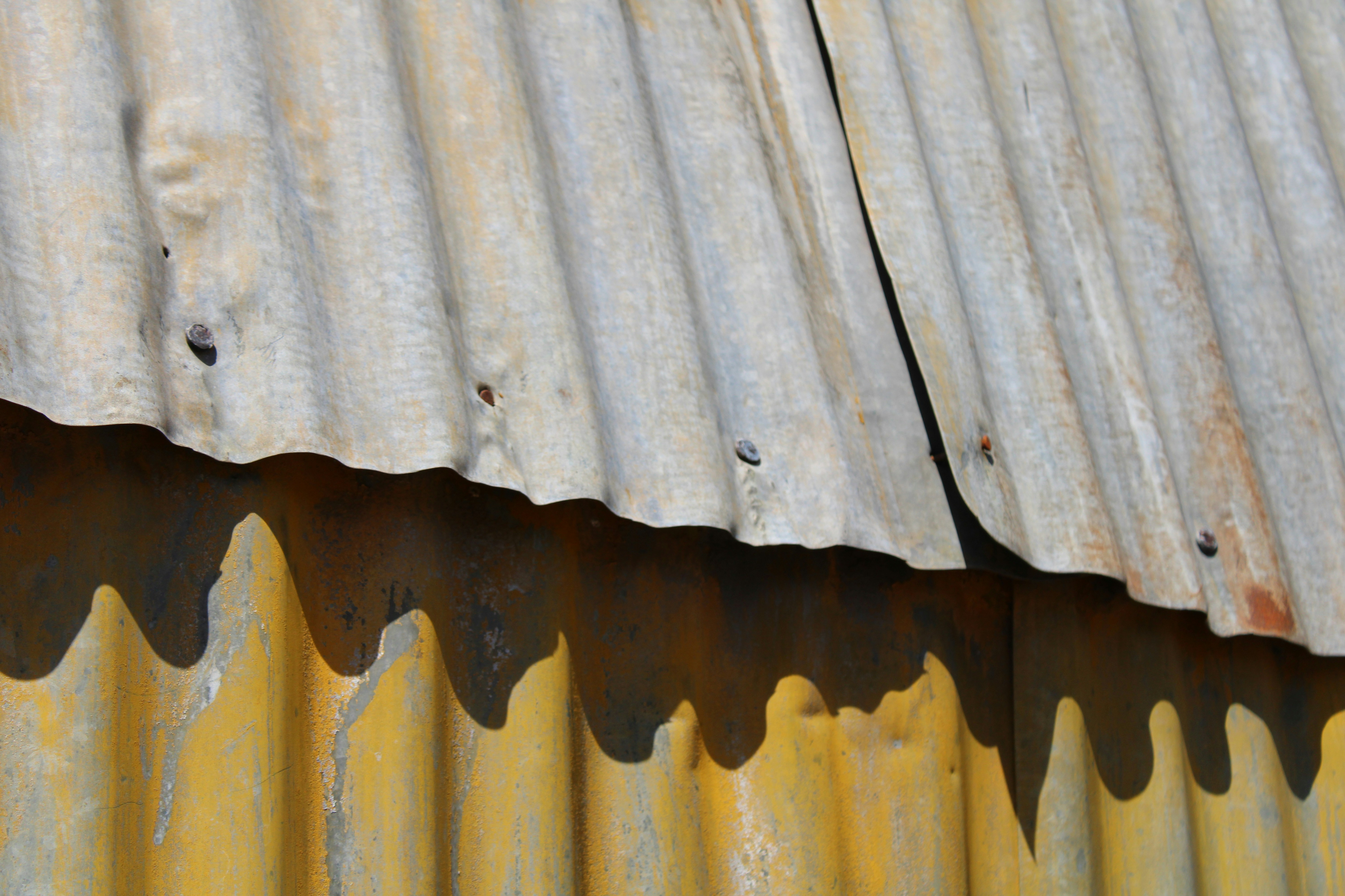Close-up of damaged roof shingles