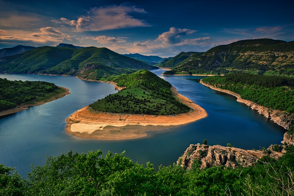 a beautiful view of a lake surrounded by mountains