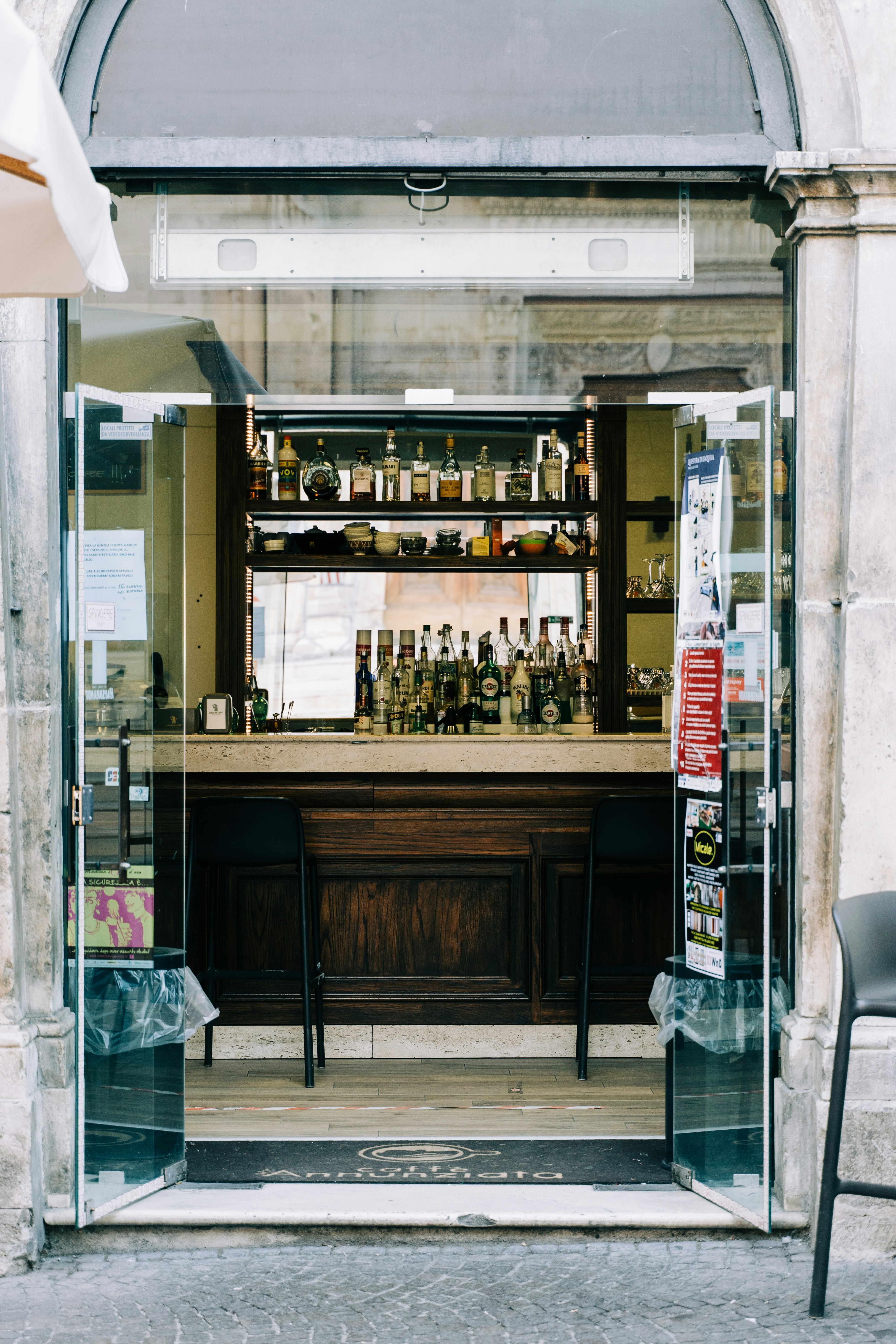 a bar with a lot of bottles behind it