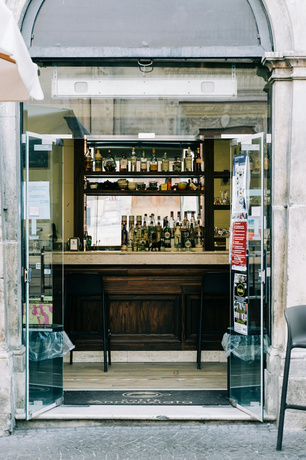 a bar with a lot of bottles behind it