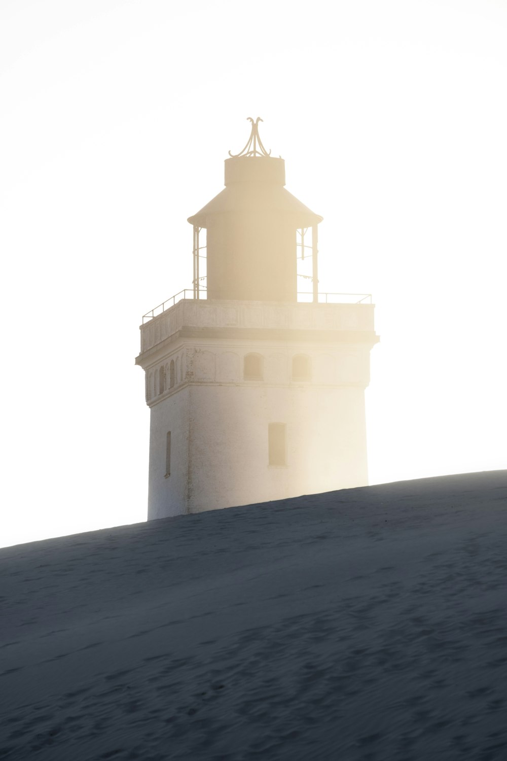 a light house on top of a hill