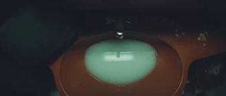 Aquaforma oval sink with a glossy surface reflecting soft ambient lighting in a cozy bathroom.
