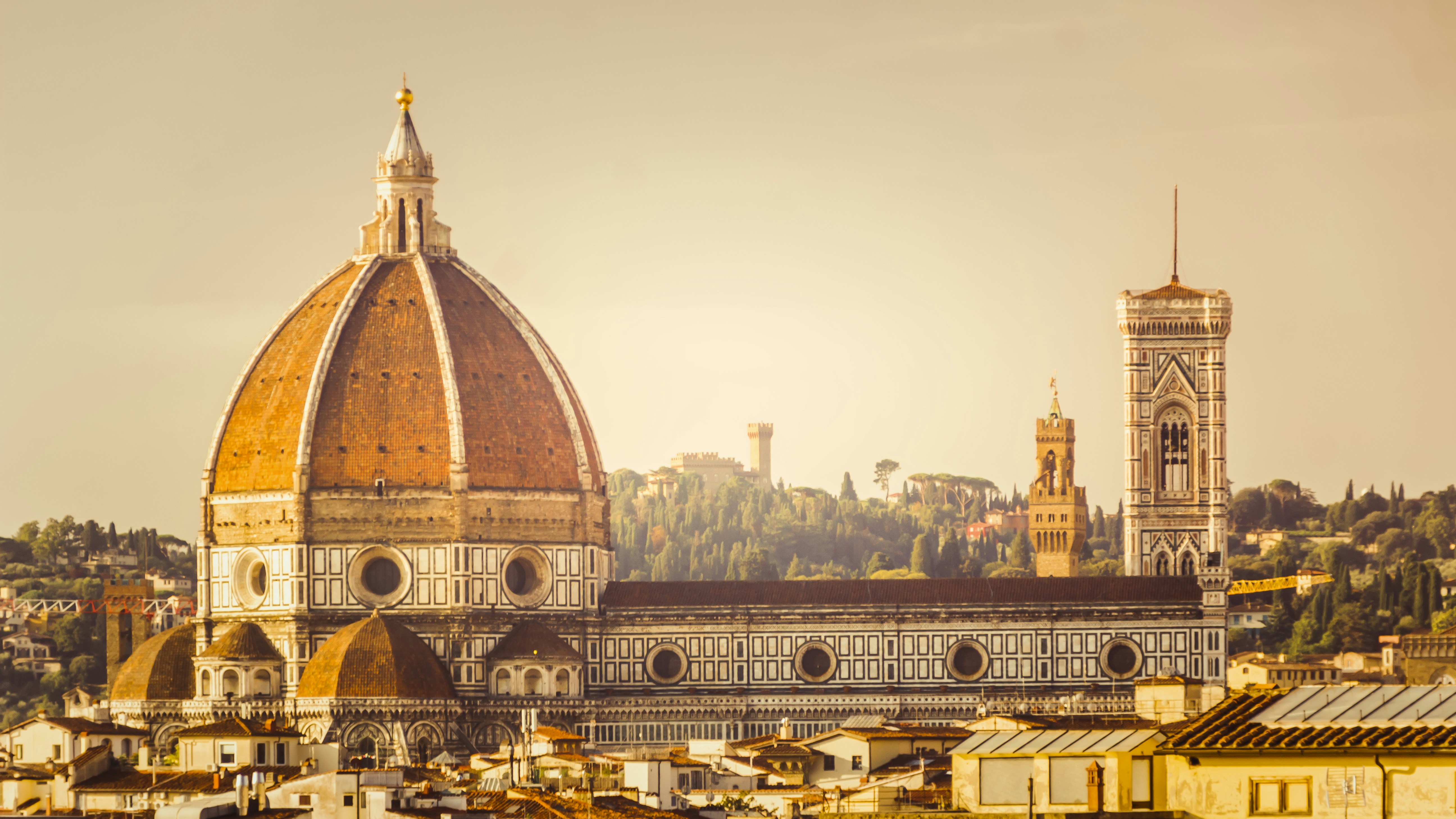 A view of a city with a dome and a clock tower