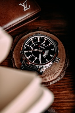 A Euro Date watch resting on a leather-bound book, highlighting its classic design.