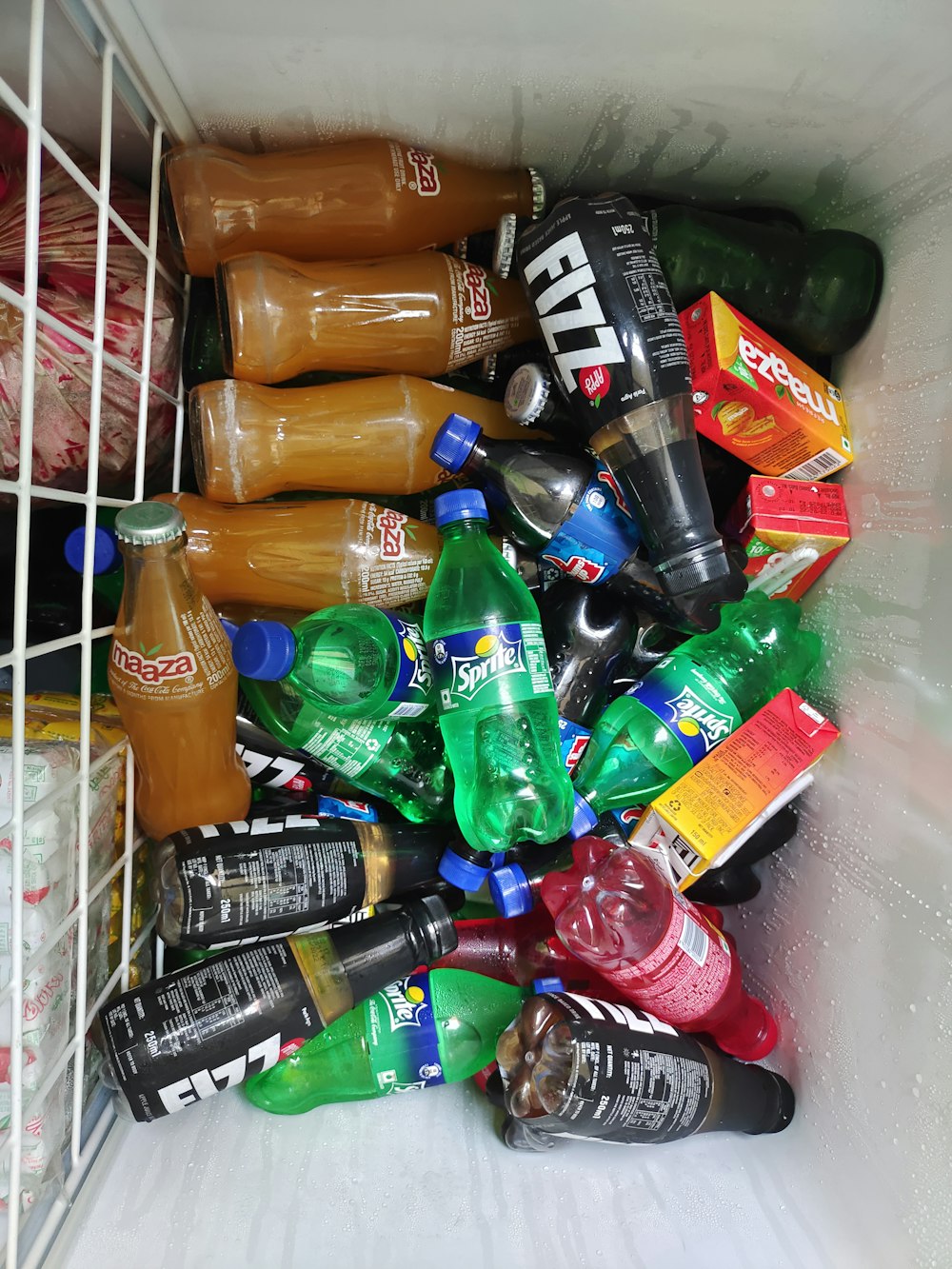 a refrigerator filled with lots of different types of drinks