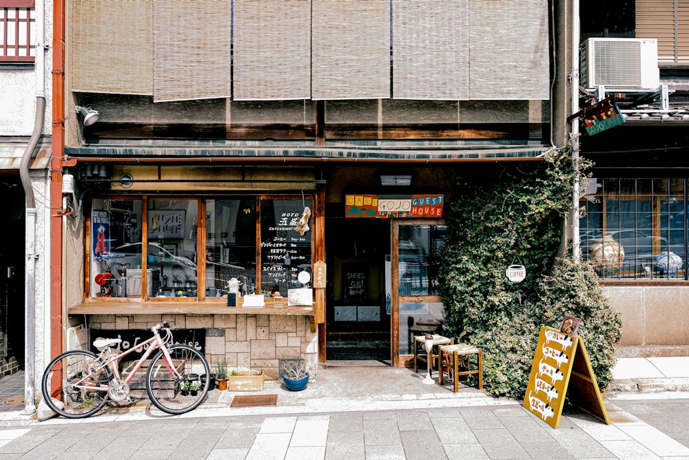 a bicycle parked on the side of a building