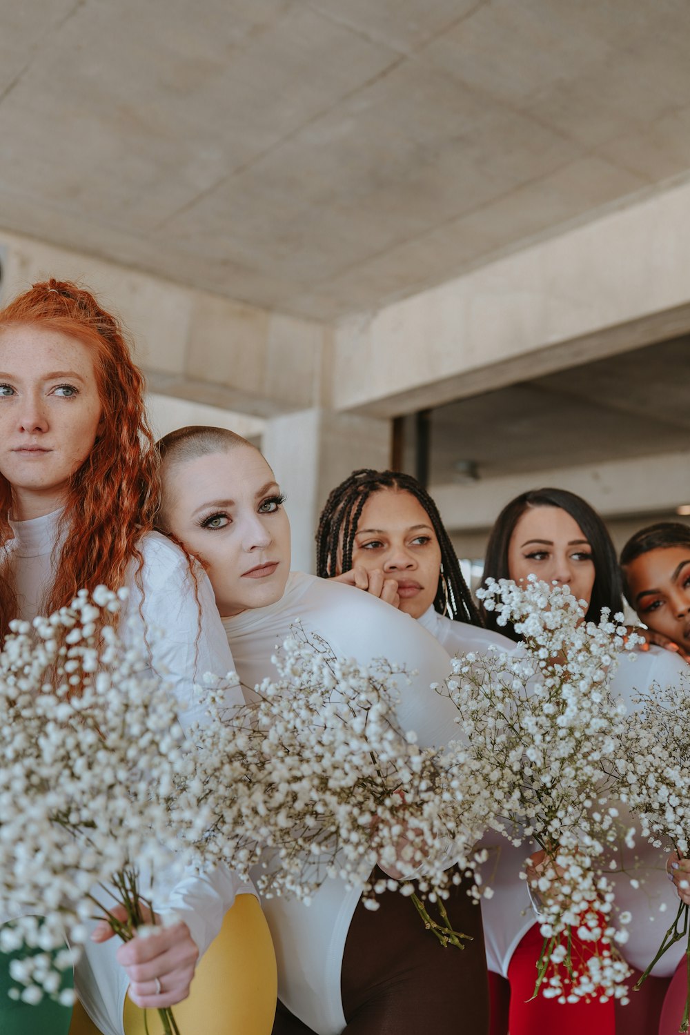 a group of women standing next to each other