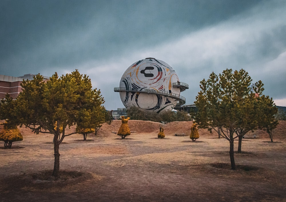 a large white object sitting in the middle of a field