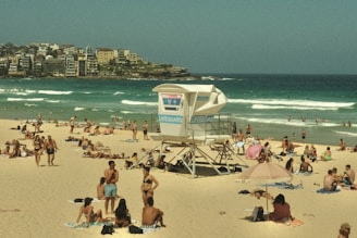 a crowded beach with many people on it
