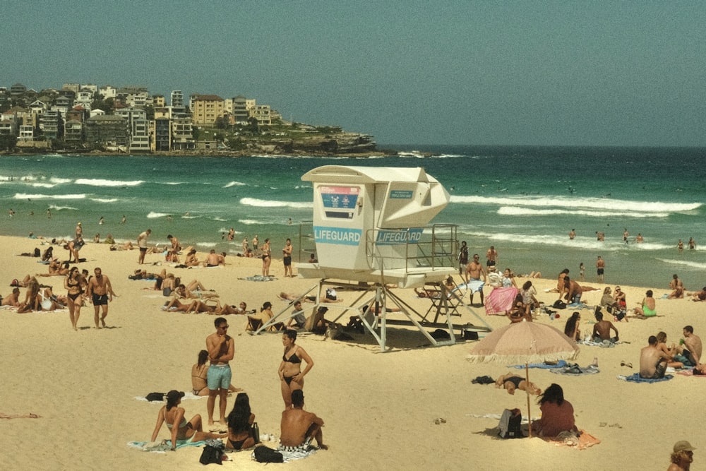 a crowded beach with many people on it