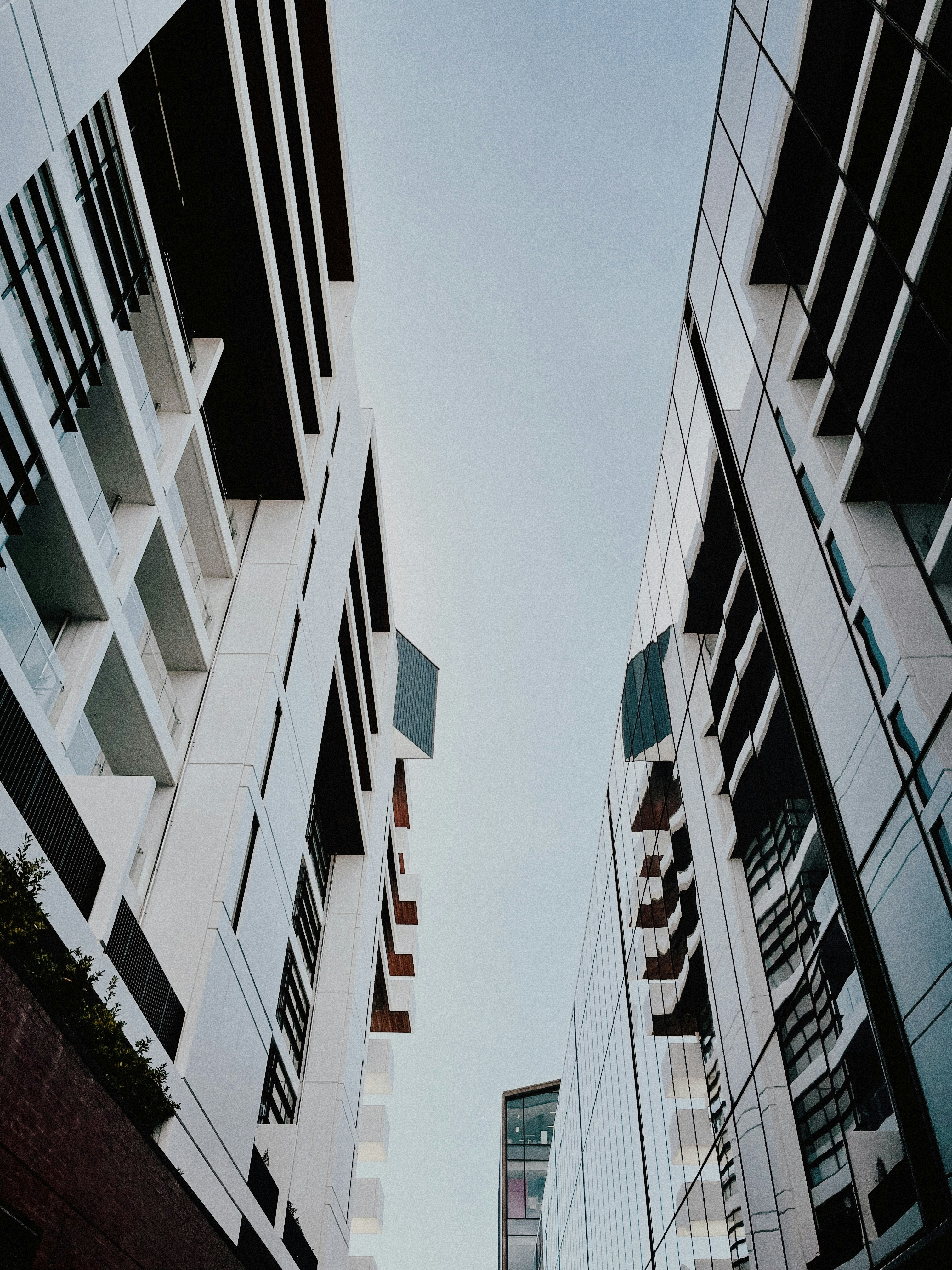 a couple of tall buildings next to each other