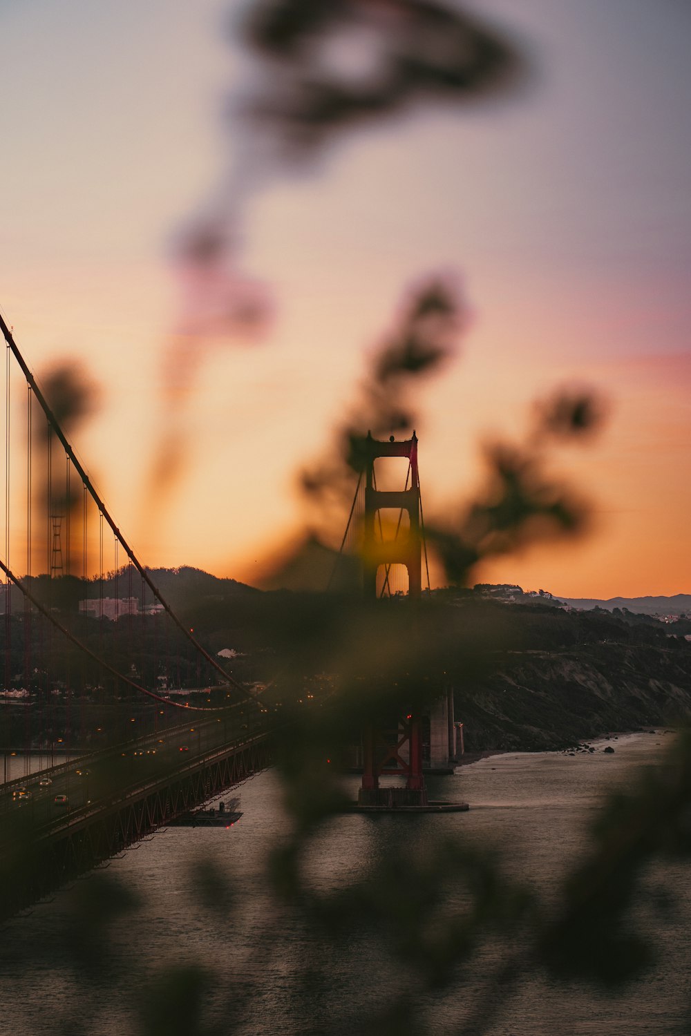 a view of the golden gate bridge at sunset