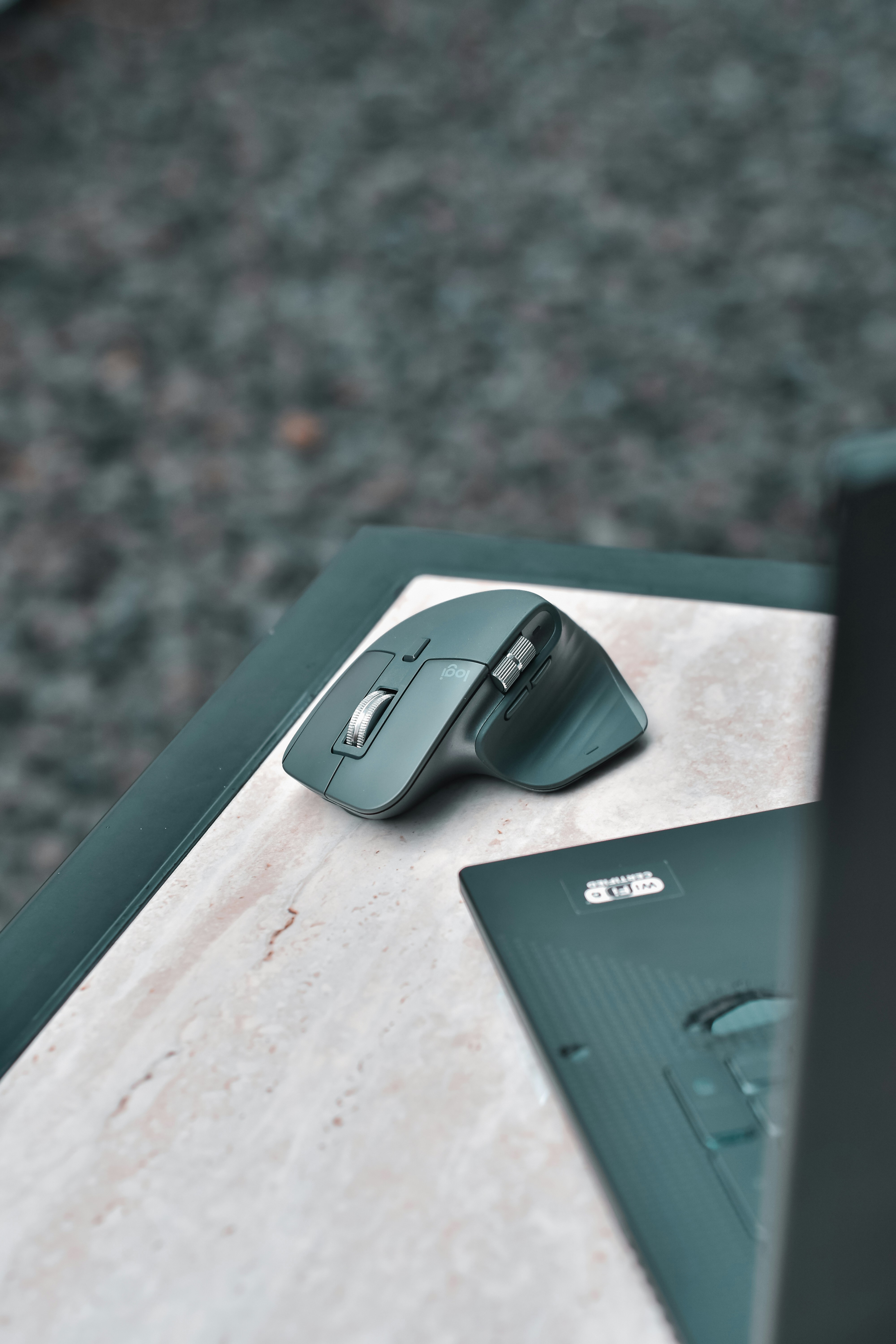 Gray Logitech wireless mouse on desk