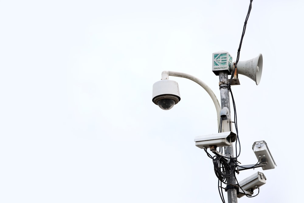 a security camera attached to a street light