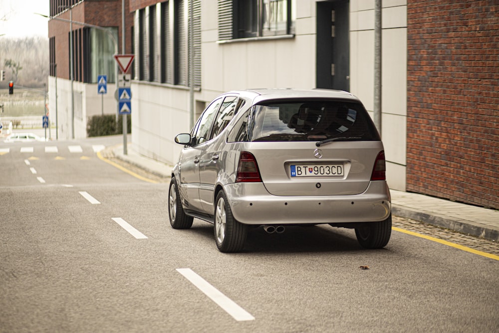 a silver car parked on the side of the road