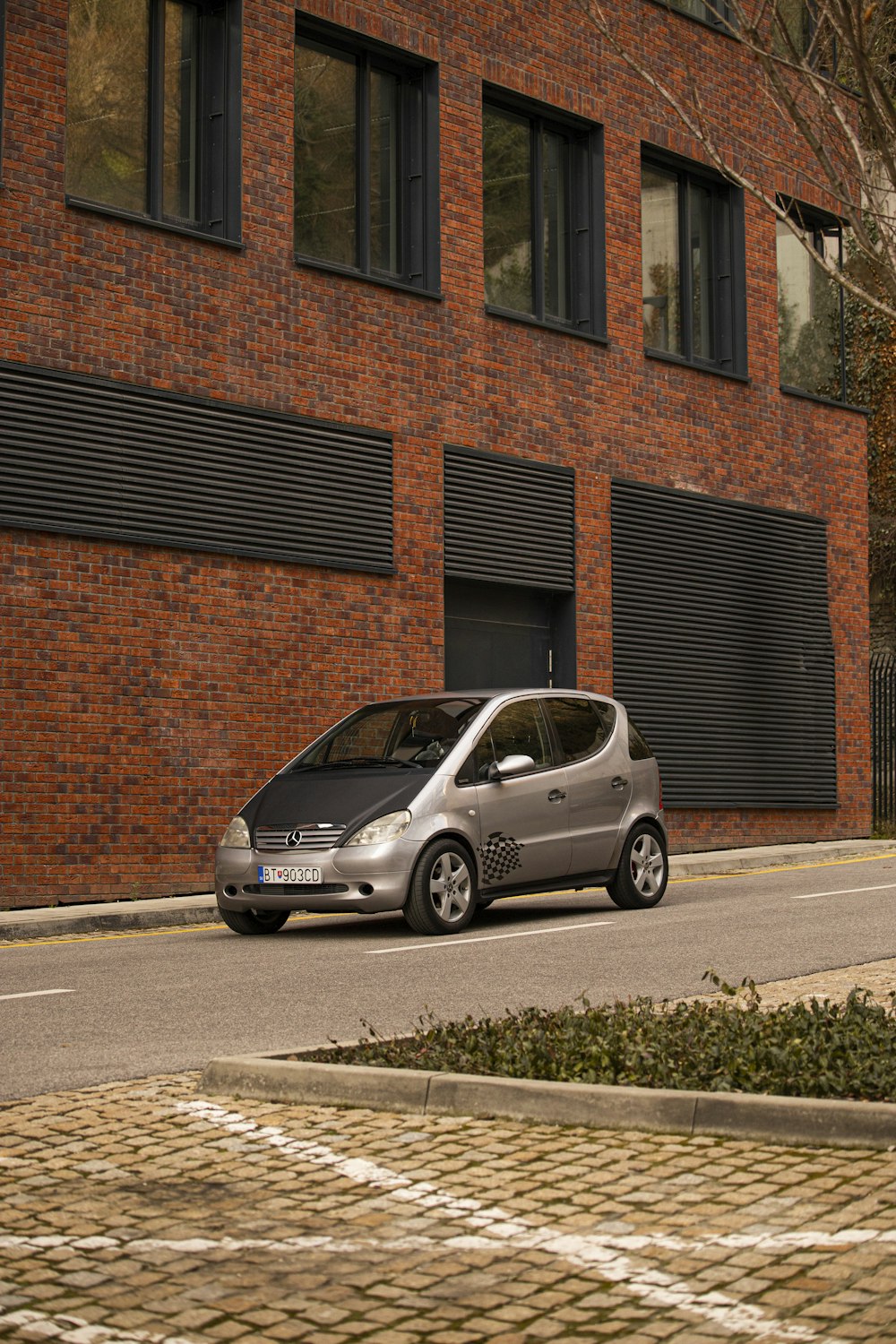 a small car parked on the side of the road