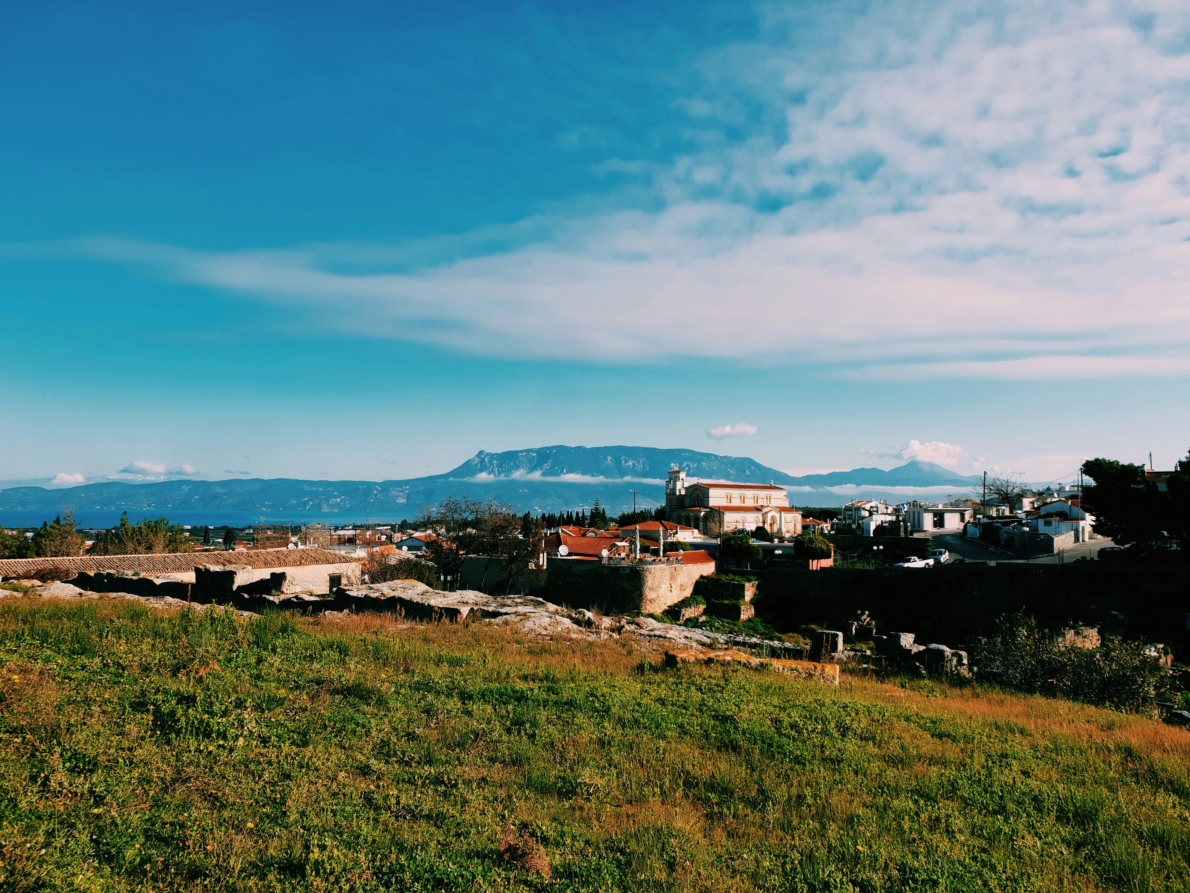 a view of a city with mountains in the background