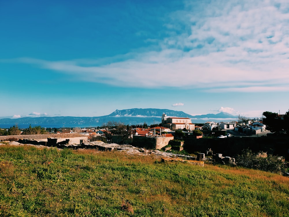 a view of a city with mountains in the background